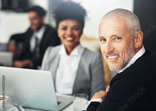 Businessman, portrait and office at law firm for meeting on legal collaboration or consultation. Attorney, team and mature lawyer at desk with commitment as advisor and advocate of justice in court