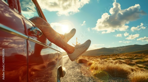 Feet sticking out of a car window against a desert backdrop during a road trip, emphasizing freedom and the joy of travel. Concept of exploration, leisure, and adventure. 