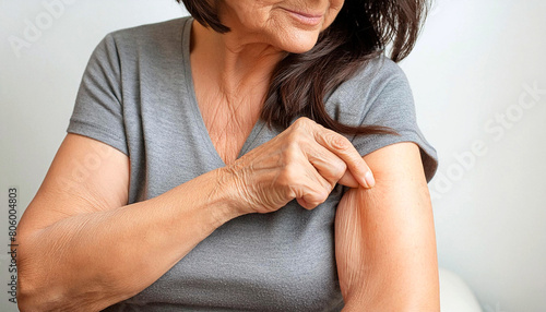 Extreme close-up of an elderly lady showing her loose skin or flab due to aging on her lower arm as she pinches it between her fingers. Generative Ai.
