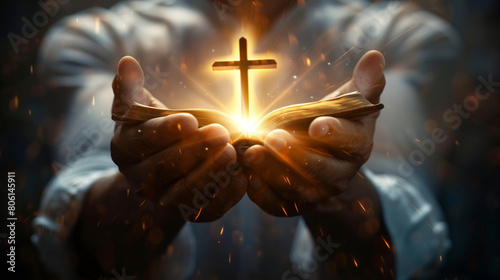 A man holding holy bible with glowing Jesus Christ Cross, Prayer concept