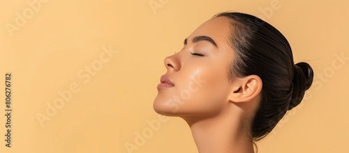 close up of a woman with clean fresh skin on a beige background, Beauty facial care.