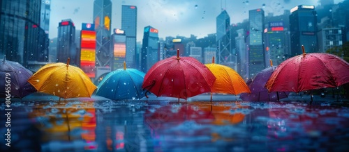 Colorful Umbrellas Amidst a Big City's Rainy Day