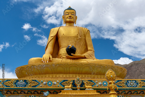 Large, colorful golden Buddha statue at the Stok Monastery in northern India