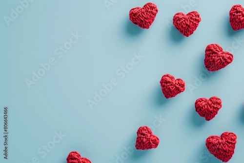 Red hearts floating on a light blue background, delicate paper cutouts, knitted and crocheted aesthetics, geometric compositions, and feminine sticker art.