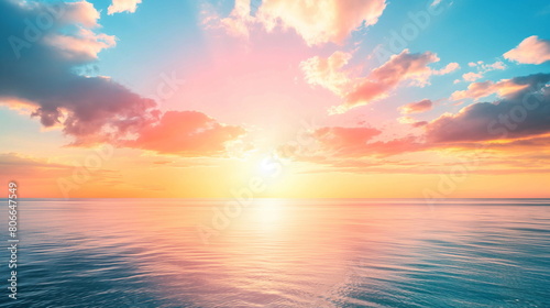 Colorful sunset against the ocean, painting the sky in shades of pink and orange