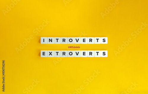 Introverts versus Extroverts Banner and Concept Image. Text on Block Letter Tiles on Yellow Background. Minimal Aesthetic