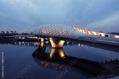 The Atyrau Bridge in the capital of Kazakhstan, Astana, connects the right and left banks of the Ishim (Yesil) River. The bridge is pedestrian, unusually and beautifully illuminated, modern, art, buil