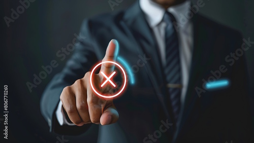 Businessman touching holographic cancel icon.