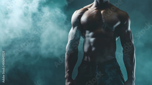 Athletic male figure highlighted in mist, showcasing his defined muscles under atmospheric lighting