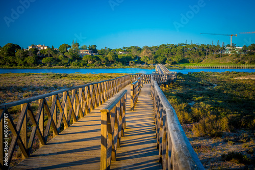 Quinta do Lago Bridge in Ria Formosa natural park in Faro, Algarve in Portugal during sunset