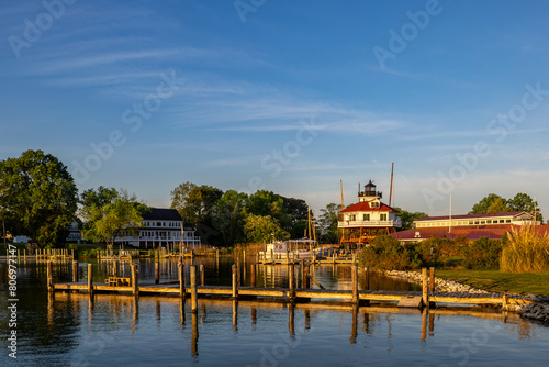 Solomons, Maryland USA A A wooden pier and lighthouse on the shore of the Patuxent River at daybreak.