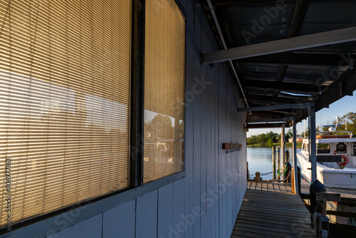 Solomons, Maryland USA A wooden boathouse on the shore of the Patuxent River at daybreak.