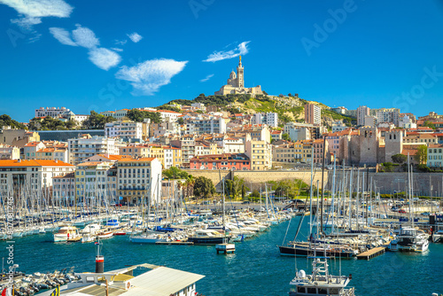 City of Marseille harbor and Notre Dame de la Garde church on the hill view