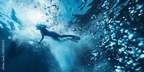 A serene underwater scene capturing a woman diver adventuring among a burst of air bubbles in the calm blue waters