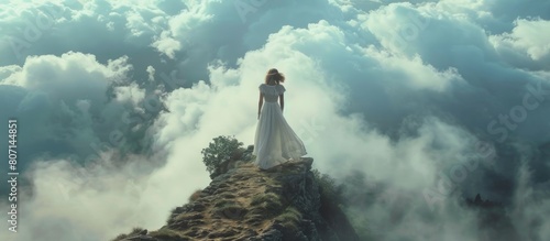 Woman model stands on a cliff in a white dress and clouds envelop her below. AI generated image