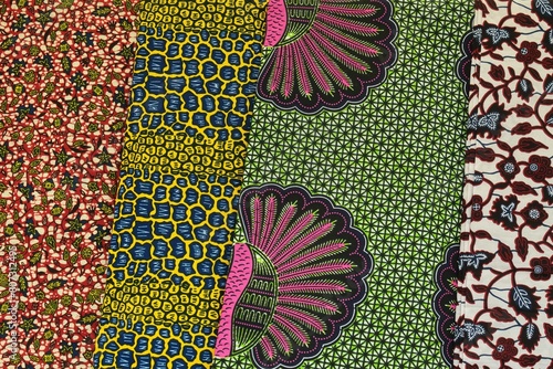 Close up of red blue yellow and green multi colour patterned African Ghanaian traditional cotton print cloths