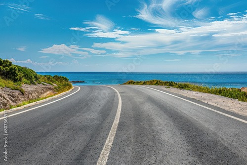 Empty Highway Along the Sea Coast Under Blue Sky
