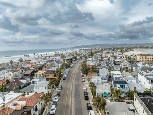 Aerial view of beach house properties for rental on Mission Beach San Diego California with cloudy sky