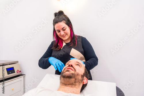 Man receiving a plasma injection as a treatment for baldness