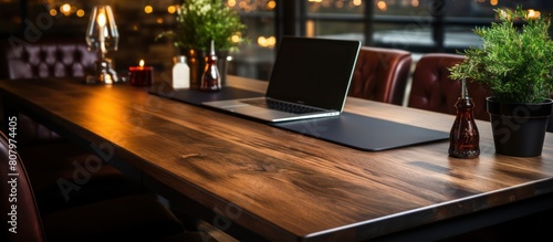 elegant luxury workplace. Modern computer, black leather mousepad on wooden table