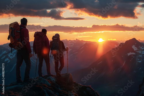 Hikers at a high viewpoint enjoying a breathtaking sunset