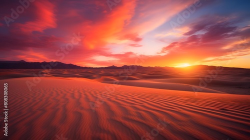 Panoramic view of sand dunes in the desert at sunset