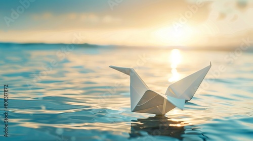 Symbolizing peace, a conceptual photo showcases a white origami dove ascending from water into the sky, representing themes of international peace, human rights, love, and hope.
