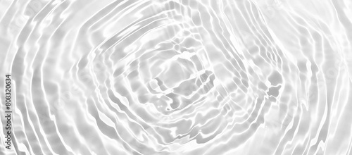 Water ripples on white Background. Water texture, white water surface with rings and ripple. Spa concept. composition with copy space. Mockup banner design for summer cosmetic product display