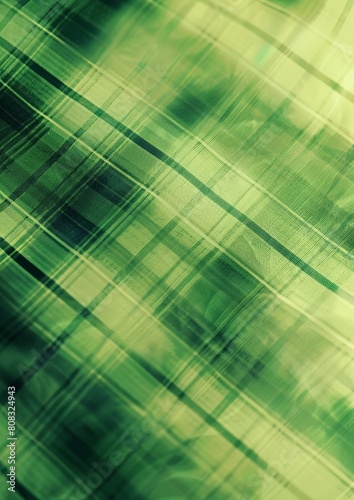 Green tartan fabric with overlaid diagonal lines in darker green.