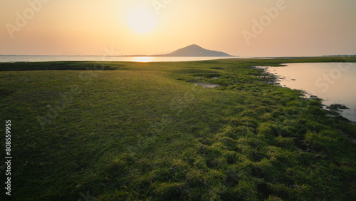 Lake landscape after the tide recedes during sunset. in Lop Buri Province, Thailand