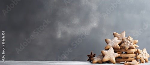 A rustic still life of festive gingerbread cookies on a grey concrete surface providing ample room for text and other graphic elements known as copy space image