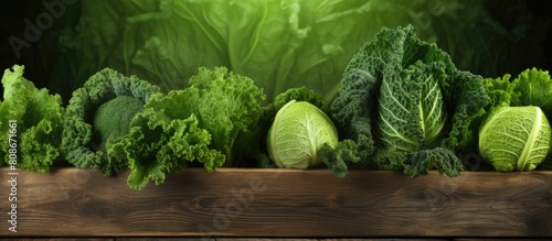 Copy space image featuring a vibrant wooden background adorned with a fresh savoy cabbage board