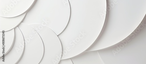 An elegant modern and minimal white geometric backdrop with soft light circles and semicircle stepped surfaces creating an abstract and stylish composition This top view image provides ample copy spa