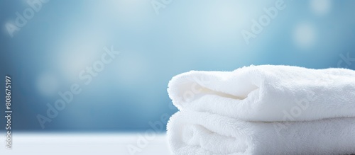 A pristine white towel with a soft and immaculate appearance. Copy space image. Place for adding text and design