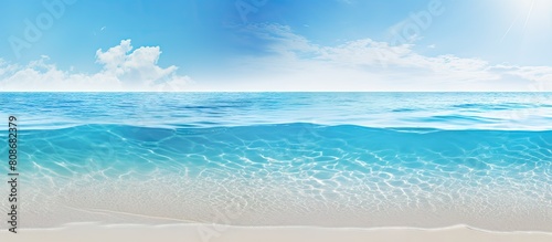 Summer beach and holiday background with copy space image featuring a serene combination of blue crystal water and white sand