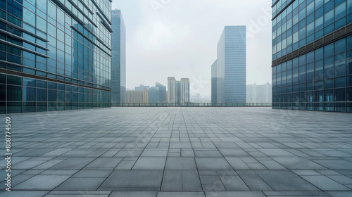 Urban office towers with open plaza on overcast day