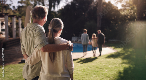 Senior couple, garden and hug from behind with family for good memories, growth and goodbye together in backyard. Man, woman and back view in nature with embrace, pride and heartwarming at home