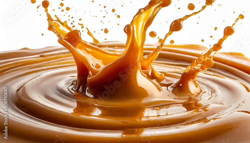 caramel liquid sauce splashes, drops isolated on white background with clipping path.