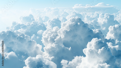 The sky is filled with fluffy white clouds, creating a serene and peaceful atmosphere. The clouds are scattered throughout the sky, with some closer to the ground and others higher up