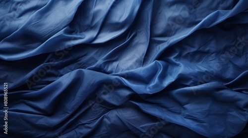 Blue soft silk fabric with folds and waves, background