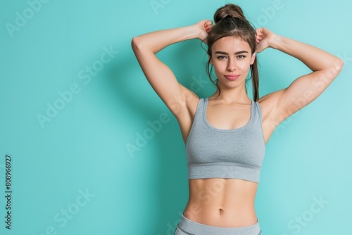 Bold lady flexing muscles against neutral background with text space