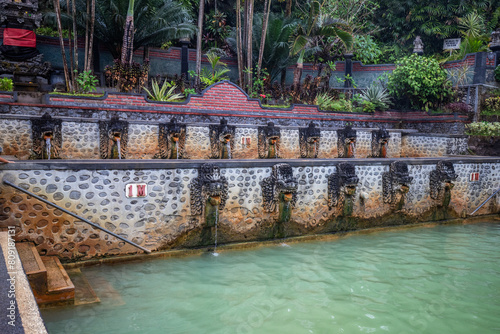 Hot springs, thermal bath in the tropical jungle. Ritual sulphurous pool for swimming. Banjar, Bali 