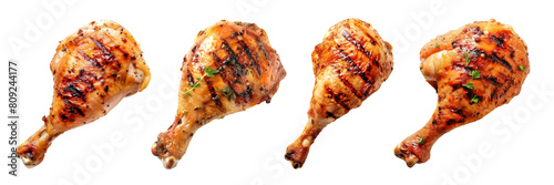Tasty grilled chicken legs set. Drumsticks isolated on transparent background, top view. BBQ food. Fast food.