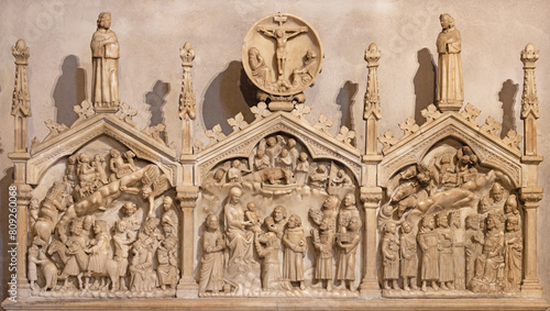 MILAN, ITALY - MARCH 6, 2024: The medieval marble relief of Three magi in the church Basilica di Sant Eustorgio by Antonio Pisano (1350).