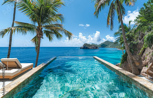 Infinity pool on the beach with coconut palm trees and beautiful seaview