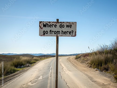 An intersection of a road, a sign that says "Where do we go from here?"