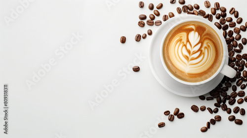 Flat lay of coffee beans and cappuccino on a white background with space for copy, in a top view.