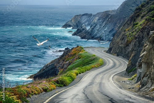 The endless coastal road winds along the edge of sheer cliffs