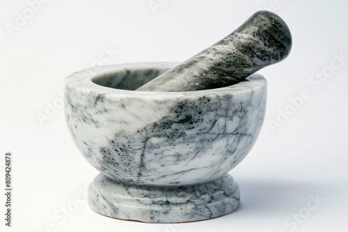 a marble mortar and pestle on a white surface
