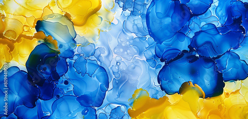 Lemon yellow and cobalt blue abstract background with alcohol ink and textured oil paint.